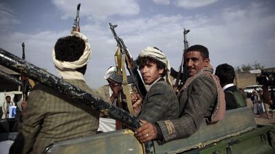 Tribesmen loyal to the Houthi rebels ride on a pickup truck during a gathering aimed at mobilising more fighters. Hani Mohammed / AP