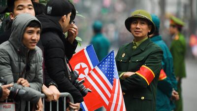 People wait behind barricades for the arrival of Kim Jong-un. AFP