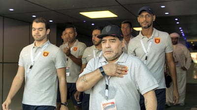 Diego Maradona leads his technical and coaching staff out as his Fujairah side prepare to take on Al Orouba at the Fujairah Stadium on Saturday. Christopher Pike / The National