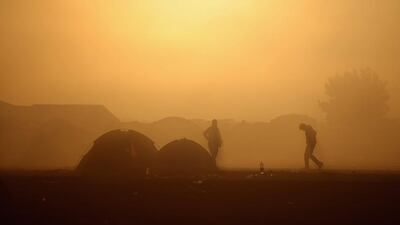 Migrants wake up to a cold morning at the Hungarian border with Serbia. The number of people leaving their homes in wartorn countries such as Syria marks the largest migration of people since World War II.