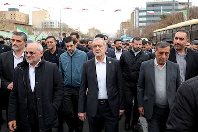Iran's President Masoud Pezeshkian, centre, at a rally in Tehran two weeks before war broke out. Reuters