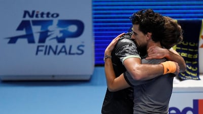 Stefanos Tsitsipas embracesDominic Thiem. Reuters