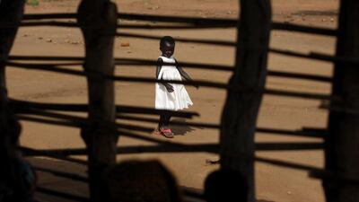 A South Sudanese refugee girl walks around the Bidi Bidi refugee camp in northern Uganda. Ben Curtis / AP Photo