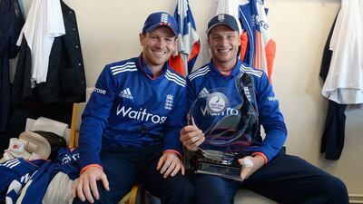 England one-day captain Eoin Morgan, left, celebrates with injured wicket-keeper Jos Buttler. Gareth Copley / Getty / June 20, 2015