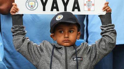 A Manchester City fan holds a sign up for Yaya Toure of Manchester City during the Premier League match between Manchester City and Sunderland at Etihad Stadium on August 13, 2016 in Manchester, England. Stu Forster / Getty Images