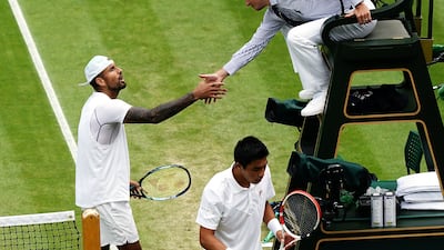 Nick Kyrgios shakes hands with the match umpire after winning his match against Brandon Nakashima. PA