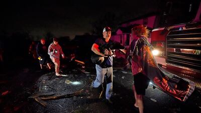 Melodie Maher's dog was rescued by her son Claude Maher and firefighters. AP Photo