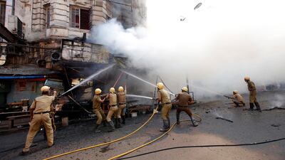 Firefighters try to douse a fire that broke out in a commercial building in a market in Kolkata, India. Rupak De Chowdhuri / Reuters