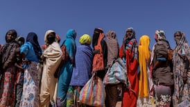 Sudanese refugees queue for food at the Oure Cassoni refugee camp after arriving from Sudan. Getty Images