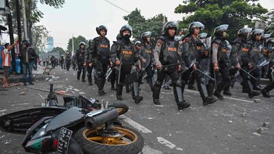 Police take a position to disperse the mob during an overnight-violent demonstration near by the Elections Oversight Body (Bawaslu) in Jakarta. AFP