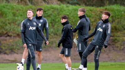 Manchester United players take part in training.