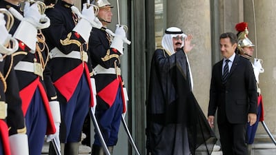 Nicolas Sarkozy, France’s president, right, looks on as Saudi Arabia’s King Abdullah bin Abdulaziz Al Saud, centre, waves from the steps of the Elysee Palace in Paris on June 21, 2007. Judith White / Bloomberg