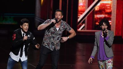 From left, actor Asher Angel, Zachary Levi and Jack Dylan Grazer appear on stage. AFP
