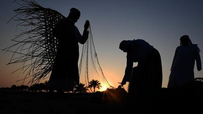 Emirati men set up fishing nets on the shore during the Dalma Festival on Dalma Island, Abu Dhabi. All Photos AFP