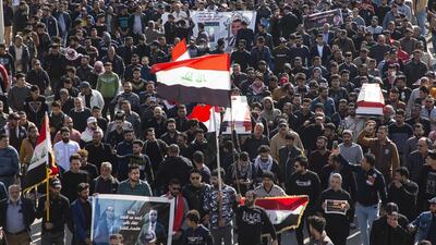 Iraqis carry mock coffins as they take part in a rally to mourn Ahmad Abdessamad, a correspondent for local television station Al-Dijla, and his cameraman Safaa Ghali were shot dead late Friday in Basra. AFP