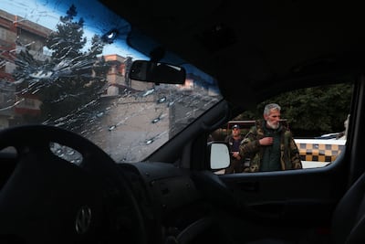 Security forces with Syria's new government inspect police vehicles in the town of Jableh, in the coastal province of Latakia, on March 10. AFP