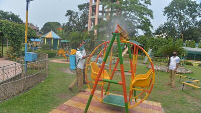 A forestry staff disinfects a park as a preventive measure against the spread of Covid-19 in Siliguri in the northeast Indian state of West Bengal, on May 5, 2021. AFP