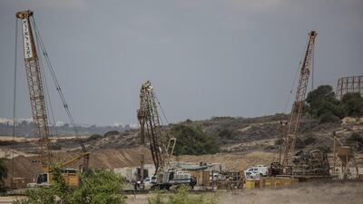 Heavy machinery works on a 60-kilometre-long underground barrier on the Israeli side of the Gaza border on September 8, 2016. Tsafrir Abayov, File/AP Photo