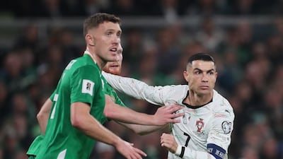 Portugal's Cristiano Ronaldo duels for the ball with Ireland's Dara O'Shea during their World Cup qualifier in Dublin. AP