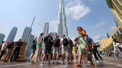 Tourists at Burj Khalifa. Economic incentive package to support Dubai's business and tourism sectors. Chris Whiteoak / The National