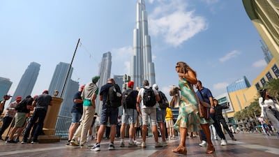 Tourists at the Burj Khalifa. Chris Whiteoak / The National
