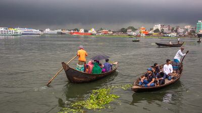 Dark storm clouds gather over the Buriganga River in Dhaka. EPA