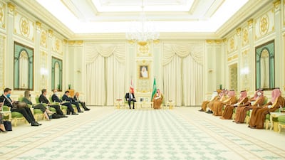 Prince Mohammed and Saudi officials meet Mr Johnson in Saudi Arabia.