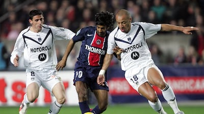 Vikash Dhorasoo, centre, vies with Bordeaux midfielders Alejandro Alonso, left, and Julien Faubert while playing for Paris Saint-Germain at the Parc des Prince in 2006. Born to Indo-Mauritian parents originally hailing from Andhra Pradesh, Dhorasoo earned 18 caps for France and was part of the team that finished runners-up at the 2006 World Cup. AFP