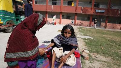 A young tuberculosis patient outside the Lal Bahadur Shastri Government Hospital at Ram Nagar in Varanasi, India. Rajesh Kumar Singh / AP Photo / February 3, 2014