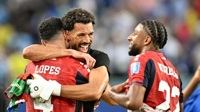 Cape Verde's goalkeeper Vozinha celebrates with teammates after the 2-2 draw with Uruguay. AFP