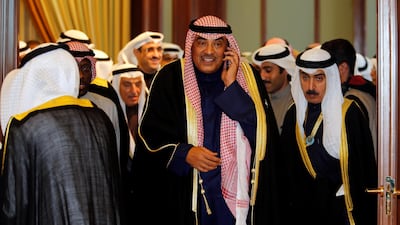 Kuwait's Foreign Minister Sabah Al Khalid Al Sabah speaks on the phone after a news conference following the annual summit of Gulf Cooperation Council, in Kuwait City, Kuwait, December 5, 2017. Hamad I Mohammed / Reuters