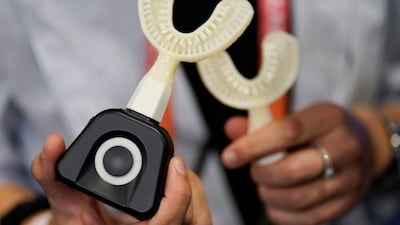 The Y-Brush electric sonic toothbrush can clean teeth in 10 seconds. AP