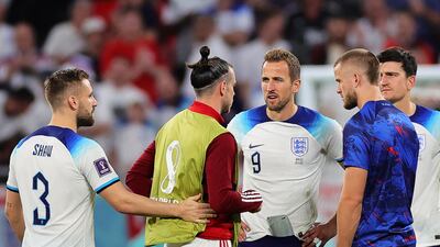 Gareth Bale of Wales with England captain Harry Kane after their match at the Ahmad bin Ali Stadium. EPA