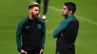 Luis Suarez, right, and Lionel Messi in training ahead of Barcelona's Uefa Champions League match against Manchester City. Nick Potts / PA