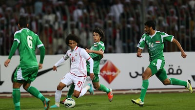 UAE's Omar Abdulrahman dribbles past Humam Tariq Faraj, Salam Shaker and Ali Adnan of Iraq. AFP