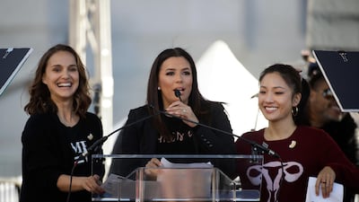 Actress Eva Longoria, centre, speaks as she is joined by Natalie Portman, left, and Constance Wu. Jae C Hon/ AP photo