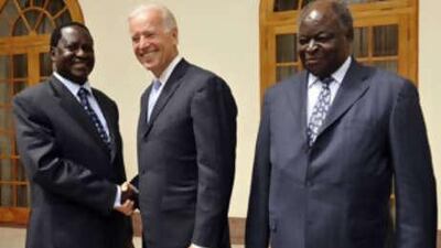 The US vice president, Joe Biden, with Kenya's prime minister, Raila Odinga, left, and president, Mwai Kibaki, right, in Nairobi, praised the country's leaders for mending their differences.