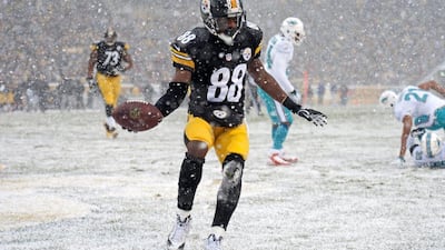 Emmanuel Sanders catches a touchdown for the Pittsburgh. The Steelers would go on to lose to the Miami Dolphins 34-28, though. Don Wright / AP