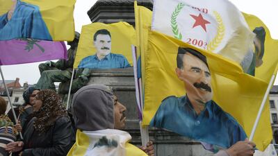 Demonstrators wave flags bearing pictures of jailed Kurdish rebel leader Abdullah Ocalan during a protest against the Turkish government in Brussels on July 28, 2015. Nato gave its strong backing to Turkey's fight against 'terrorism' at an emergency meeting called to discuss Ankara's strikes against ISIL fighters and Kurdish rebels. John Thys/AFP Photo