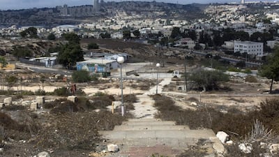 A staircase leading down a slope where several old caravans stand on the area of East Jerusalem called Givat Hamatos, overlooking Jerusalem. Jim Hollander / EPA