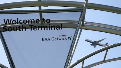 An aeroplane flies over a welcome sign as it takes off from Gatwick Airport. RawandAir is to start flights to the airport in May. Sang Tan / AP