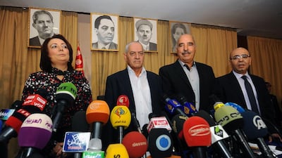 From left, Wided Bouchamaoui, Houcine Abbassi, Abdessattar ben Moussa and Mohammed Fadhel Mahmoud, leaders of the four groups comprising the Tunisian National Dialogue Quartet, which was yesterday honoured when the Nobel committee awarded the coalition with its annual peace prize. Fethi Belaid / AFP
