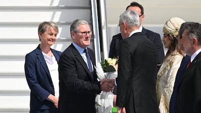 British Prime Minister Keir Starmer and Foreign Secretary Yvette Cooper are welcomed by Turkish Health Minister Kemal Memisoglu on arrival in Ankara. EPA