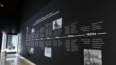 A timeline of moments – both the history of the UAE and the life of Ramesh Shukla – run along one wall. Chris Whiteoak / The National