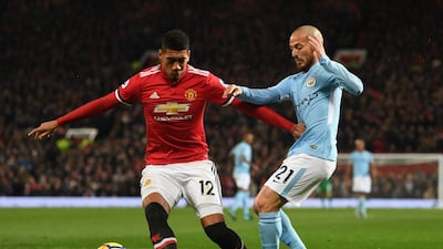 Manchester United's Chris Smalling, left, in action against David Silva of Manchester City, is ready to take on Leicester City and Jamie Vardy on Saturday. Michael Regan / Getty Images