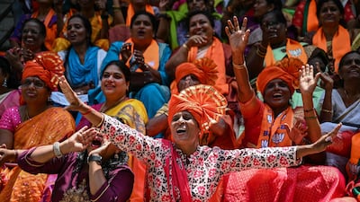 In Bengaluru, supporters of the Bharatiya Janata Party celebrate as election results appear on a big screen. AFP