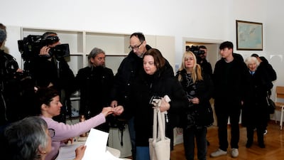 People arrive to vote during the second round of the presidential elections in Zagreb. EPA