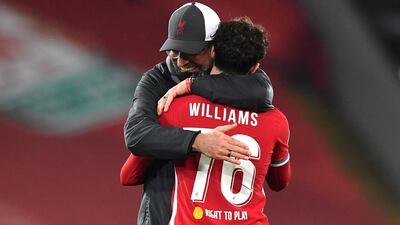 Liverpool manager Juergen Klopp (L) congratulates player Neco Williams after the UEFA Champions League group D soccer match between Liverpool FC and Ajax Amsterdam in Liverpool, Britain, December 1, 2020. EPA