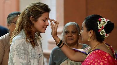 Mrs Trudeau is welcomed on her arrival at the Sophia College for Women for the interactive session in Mumbai. Punit Paranjpe / AFP Photo