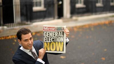 A journalist reports from outside No 10 Downing Street in central London. AFP